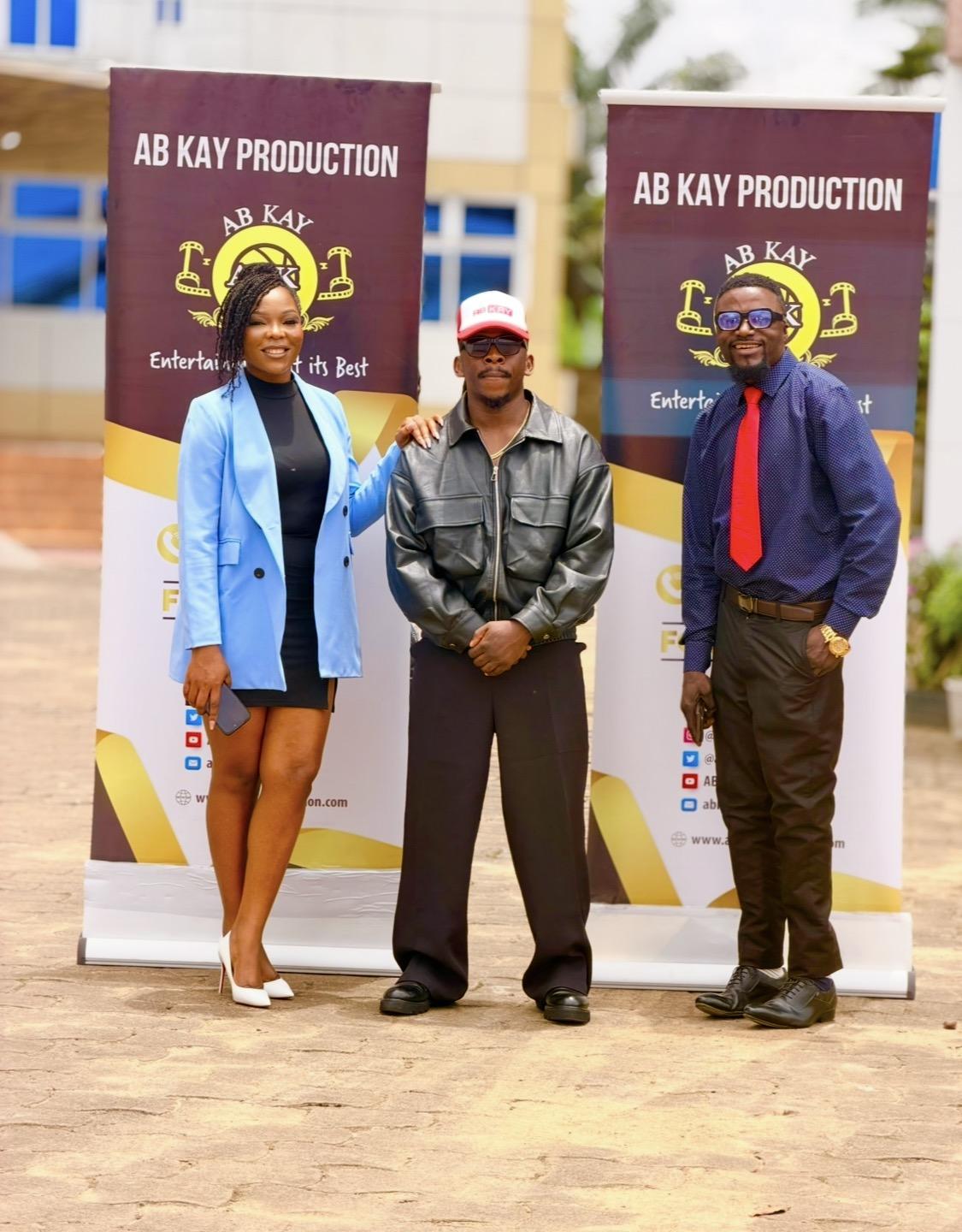 Oken with the AB KAY Production team after signing